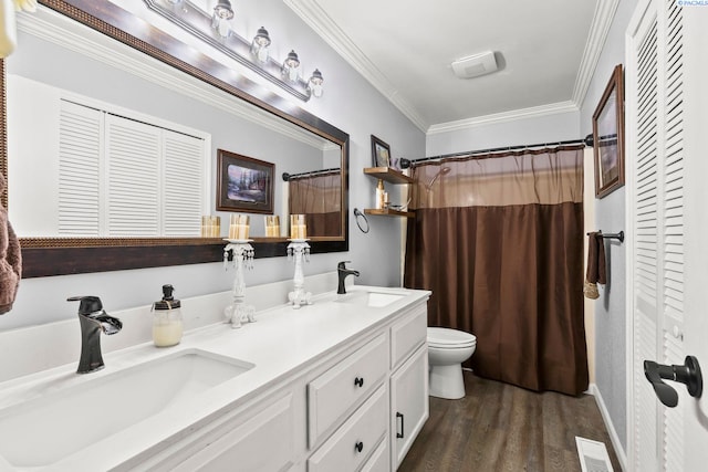 602 N 57th St, Yakima, WA 98901 - bathroom featuring a closet, double vanity, wood finished floors, crown molding, and curtained shower