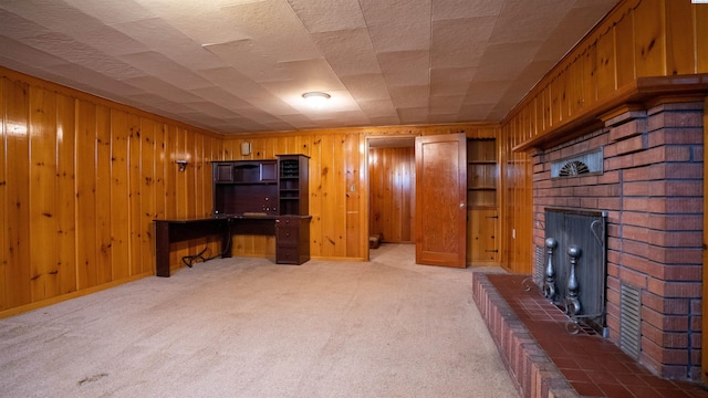 201 W Cooper St, Colfax, WA 99111 - unfurnished living room with a brick fireplace, wood walls, and light carpet