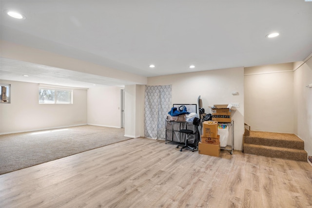 home office with light hardwood / wood-style flooring