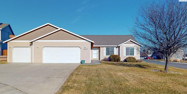 single story home featuring a garage and a front lawn