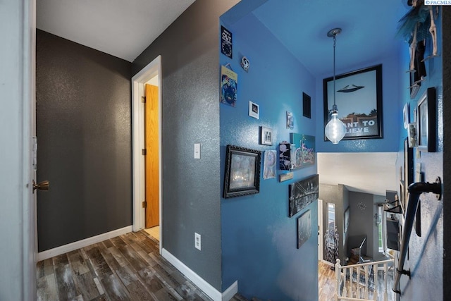 3715 Meadow Beauty Dr, Pasco, WA 99301 - hall with a textured wall, baseboards, and wood finished floors
