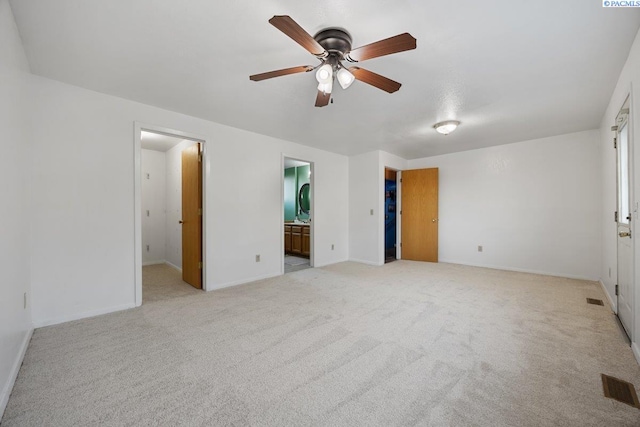 3715 Meadow Beauty Dr, Pasco, WA 99301 - unfurnished bedroom featuring ensuite bath, visible vents, and light colored carpet