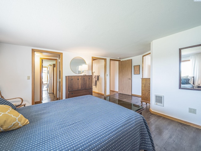 3680 E Euclid Rd, Mabton, WA 98935 - bedroom with wood finished floors, baseboards, and a textured ceiling