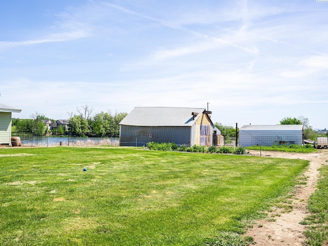 3680 E Euclid Rd, Mabton, WA 98935 - view of grassy yard with an outbuilding, an outdoor structure, and a water view