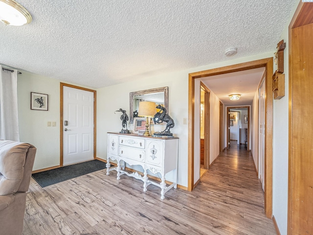 3680 E Euclid Rd, Mabton, WA 98935 - entrance foyer with wood finished floors, a textured ceiling, and baseboards