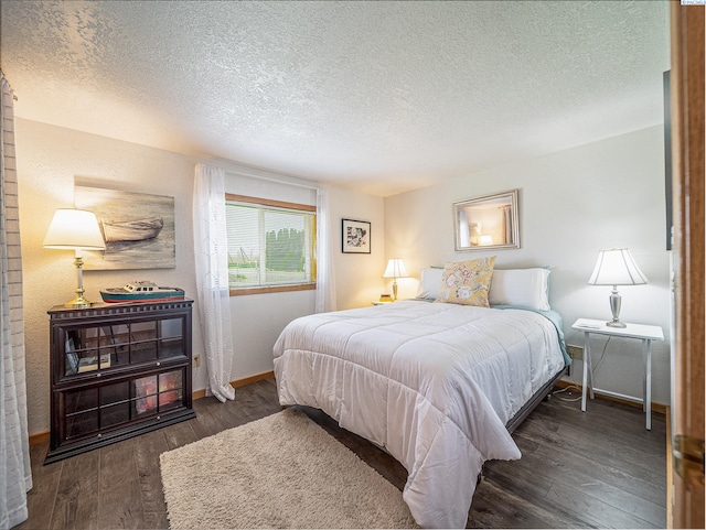 3680 E Euclid Rd, Mabton, WA 98935 - bedroom featuring wood finished floors, a textured ceiling, and baseboards