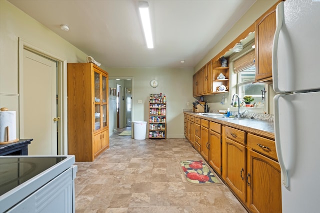 kitchen with white refrigerator and sink