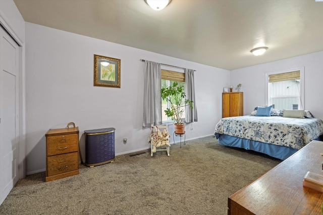 bedroom featuring a closet and carpet flooring