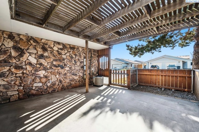 view of patio with central AC and a pergola