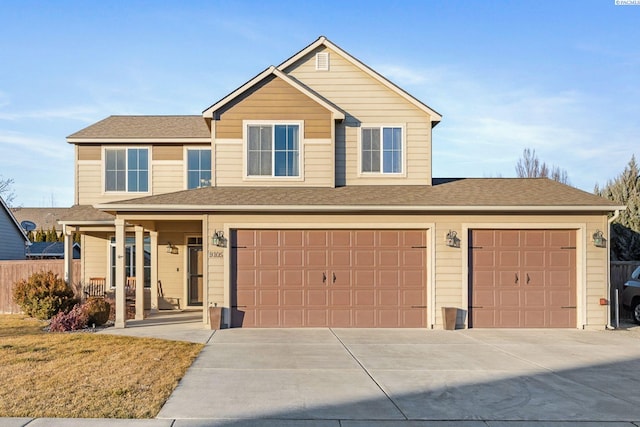 view of front property with a garage and a front yard