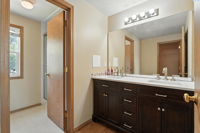 4505 S Dayton Ct, Kennewick, WA 99337 - bathroom featuring double vanity and baseboards