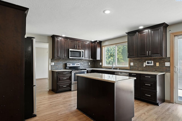 4505 S Dayton Ct, Kennewick, WA 99337 - kitchen featuring appliances with stainless steel finishes, light wood finished floors, tasteful backsplash, and recessed lighting