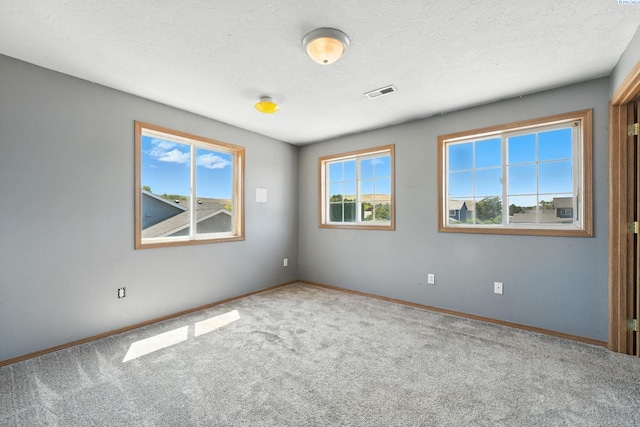 4505 S Dayton Ct, Kennewick, WA 99337 - spare room featuring carpet floors and a textured ceiling