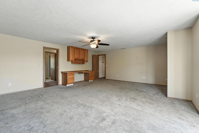 4505 S Dayton Ct, Kennewick, WA 99337 - unfurnished living room featuring a ceiling fan, light carpet, and an office area