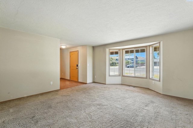 4505 S Dayton Ct, Kennewick, WA 99337 - carpeted spare room featuring a textured ceiling and baseboards