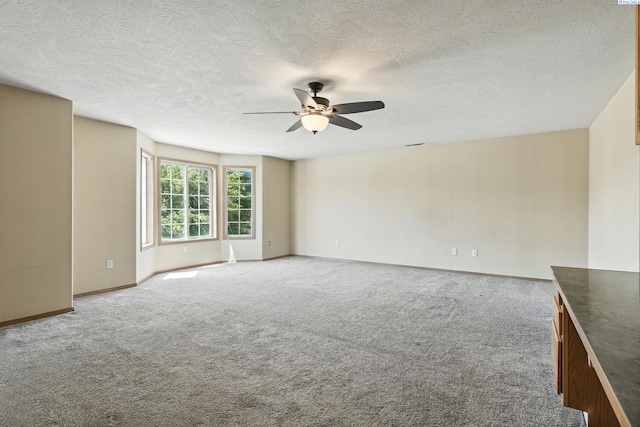 4505 S Dayton Ct, Kennewick, WA 99337 - unfurnished room featuring ceiling fan, carpet, and a textured ceiling