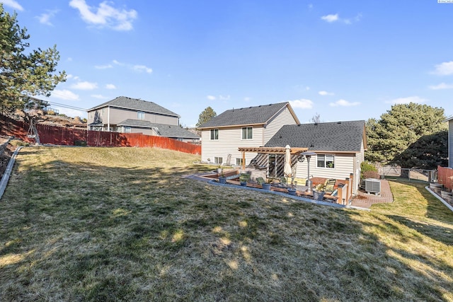 rear view of property with a lawn, central AC unit, a patio area, a pergola, and a fenced backyard