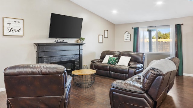 living room with lofted ceiling and dark hardwood / wood-style floors