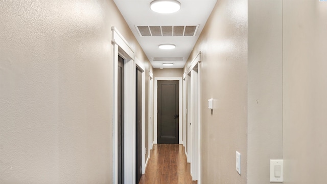 corridor with dark wood-type flooring