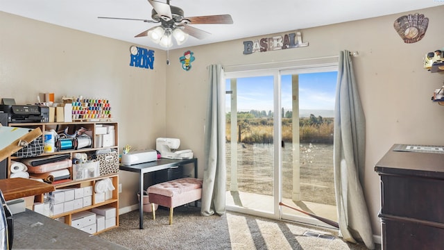 carpeted office with ceiling fan