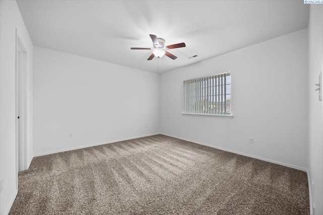 carpeted empty room with ceiling fan