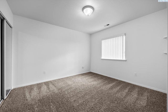 unfurnished room with carpet