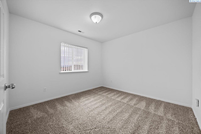 spare room featuring carpet floors