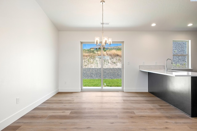 6562 W 30th Pl, Kennewick, WA 99338 - unfurnished dining area featuring a sink, a chandelier, plenty of natural light, baseboards, and recessed lighting