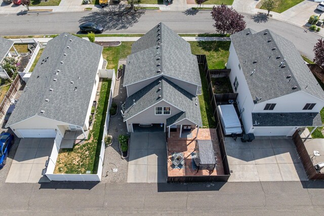 birds eye view of property with a residential view