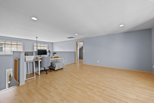 office with visible vents, recessed lighting, baseboards, and wood finished floors