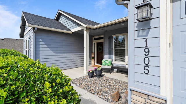 1905 S Harrison St, Kennewick, WA 99338 - view of exterior entry featuring roof with shingles and covered porch