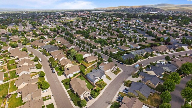 1905 S Harrison St, Kennewick, WA 99338 - aerial view of property and surrounding area featuring a mountain backdrop and nearby suburban area