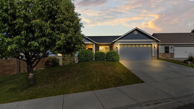 1905 S Harrison St, Kennewick, WA 99338 - single story home with a garage, a lawn, and driveway