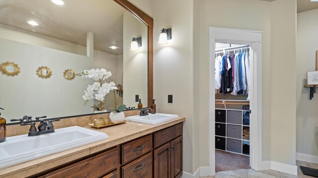 1905 S Harrison St, Kennewick, WA 99338 - full bathroom featuring a spacious closet, double vanity, baseboards, and recessed lighting