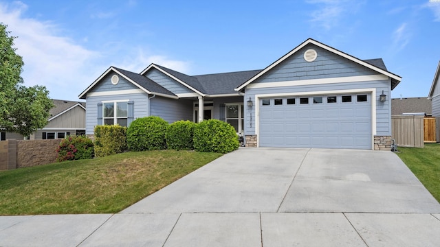 1905 S Harrison St, Kennewick, WA 99338 - ranch-style home with an attached garage, driveway, and stone siding