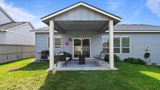 1905 S Harrison St, Kennewick, WA 99338 - back of property featuring board and batten siding, a patio area, and roof with shingles