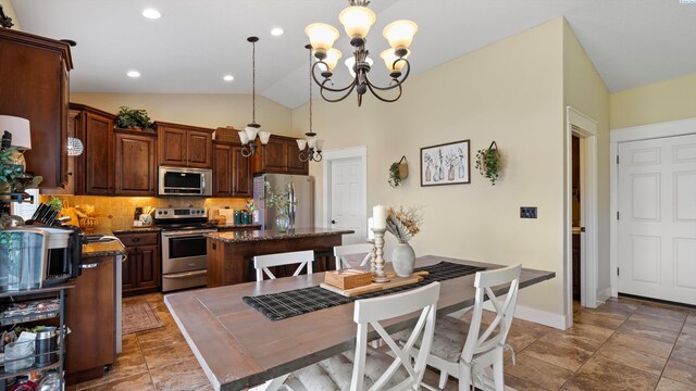 1905 S Harrison St, Kennewick, WA 99338 - dining space with a chandelier, vaulted ceiling, baseboards, and recessed lighting