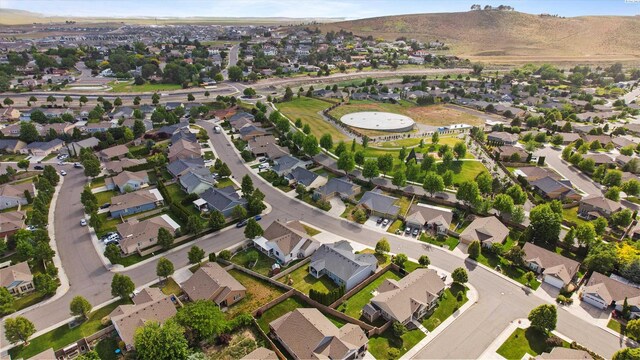 1905 S Harrison St, Kennewick, WA 99338 - aerial view of property and surrounding area with nearby suburban area and a mountain backdrop