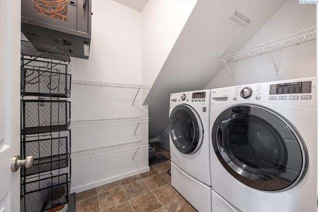 clothes washing area with laundry area and washer and dryer