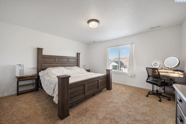 bedroom with light colored carpet, visible vents, a textured ceiling, and baseboards