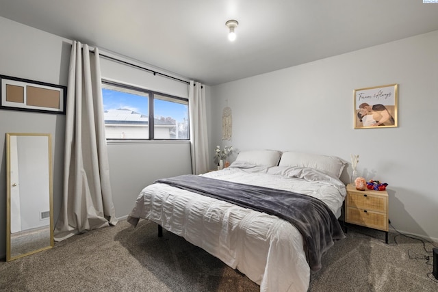 bedroom with carpet flooring and baseboards