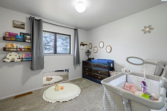 bedroom with carpet flooring and baseboards