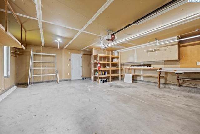 7009 W 8th Ave, Kennewick, WA 99336 - garage featuring a workshop area and a garage door opener