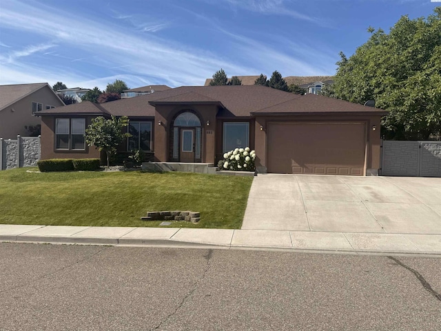 483 Aimee Dr, Richland, WA 99352 - ranch-style home with an attached garage, concrete driveway, and stucco siding