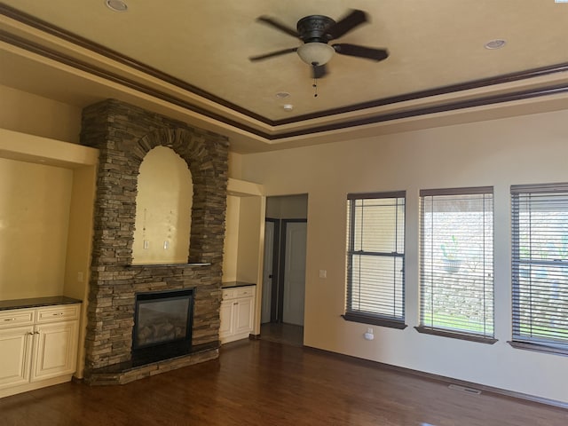 483 Aimee Dr, Richland, WA 99352 - unfurnished living room featuring a ceiling fan, dark wood finished floors, a fireplace, and crown molding