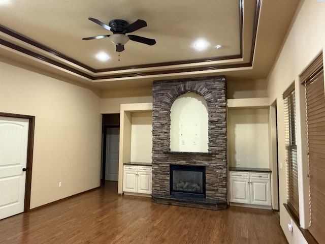 483 Aimee Dr, Richland, WA 99352 - unfurnished living room with a raised ceiling, a ceiling fan, ornamental molding, dark wood-style flooring, and a fireplace