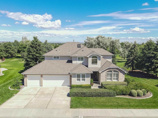 view of front facade featuring a garage and a front lawn