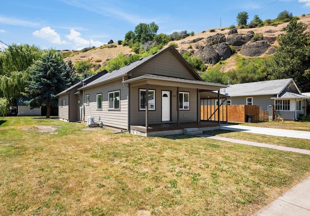 205 W 8th St, Colfax, WA 99111 - view of front of property featuring covered porch, concrete driveway, and an attached carport