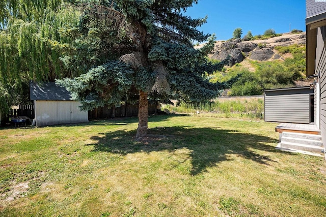 205 W 8th St, Colfax, WA 99111 - view of grassy yard featuring a storage shed