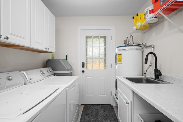 205 W 8th St, Colfax, WA 99111 - laundry area featuring washing machine and clothes dryer, cabinet space, and strapped water heater